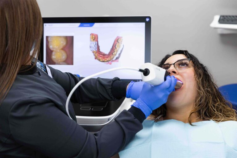 hygienist using the intraoral camera on a patient